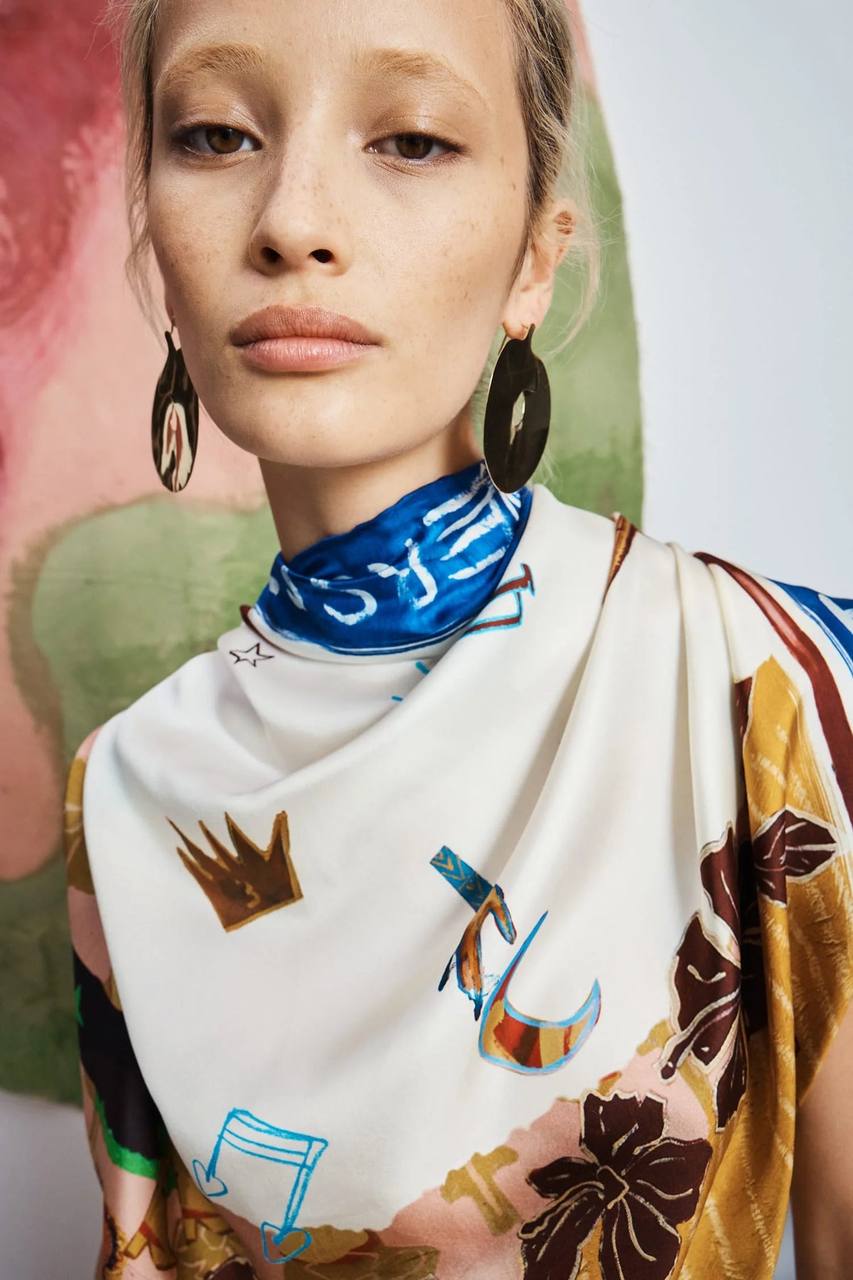 Close-up of ALEMAIS Tangible Love Scarf tied around model's neck.