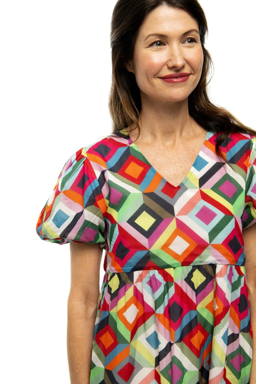 Woman wearing Briton Courts Jett Kaleidoscope dress.