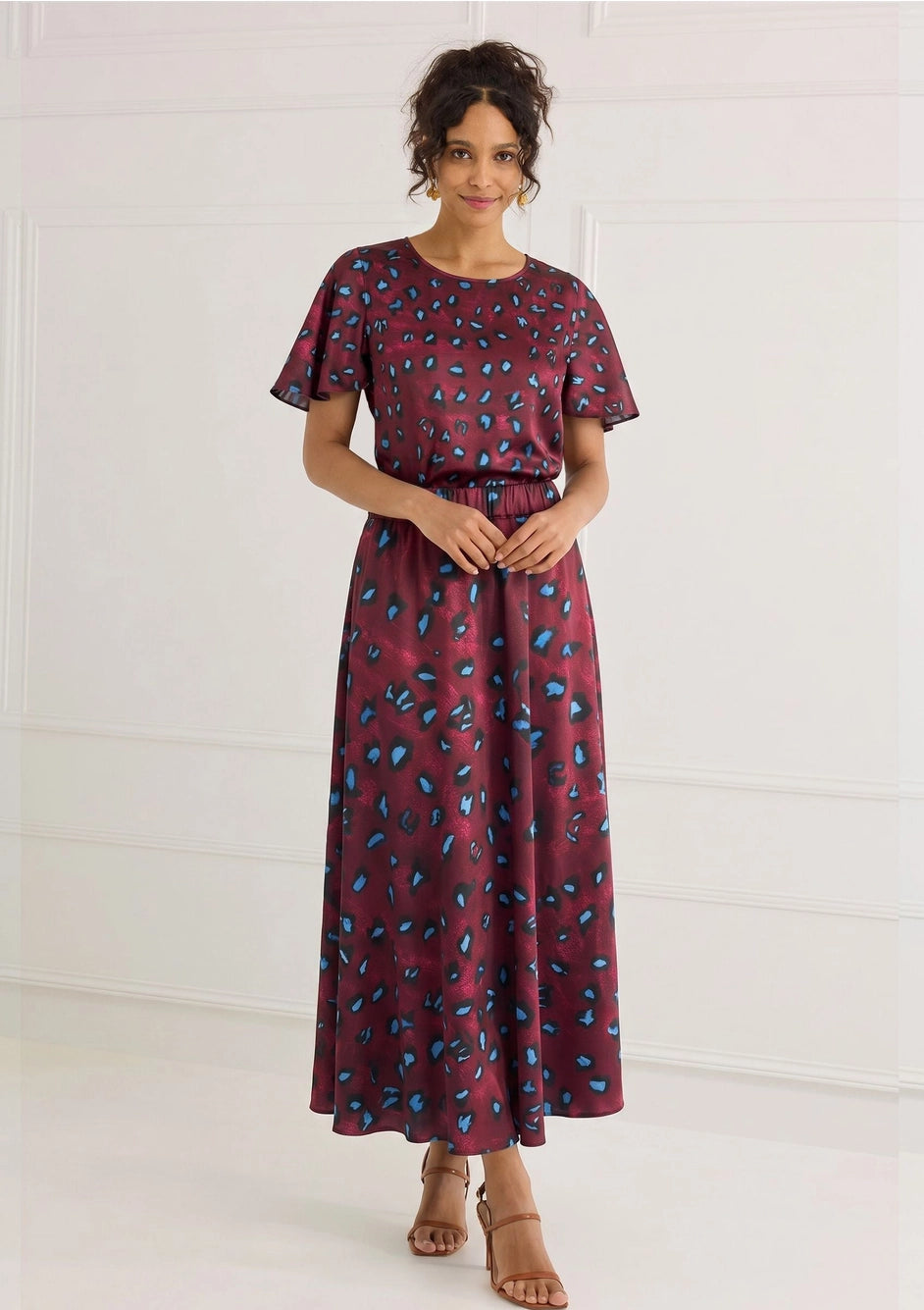 Model wearing ALIVIA Lizzie Skirt styled with coordinating printed top