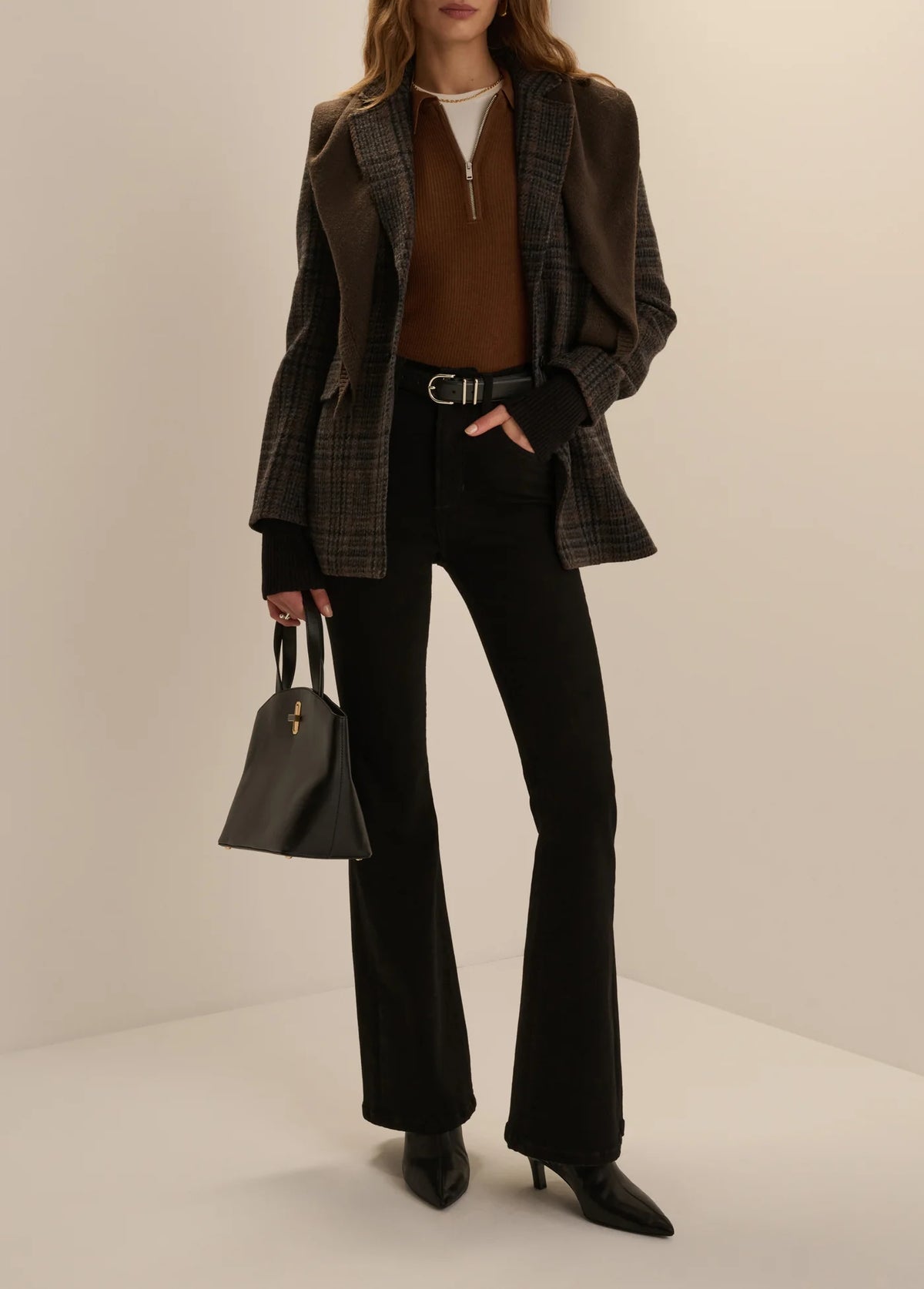 Favorite Daughter Downtown Polo in chocolate brown styled with black high-waisted trousers at Harringtons Boutique.
