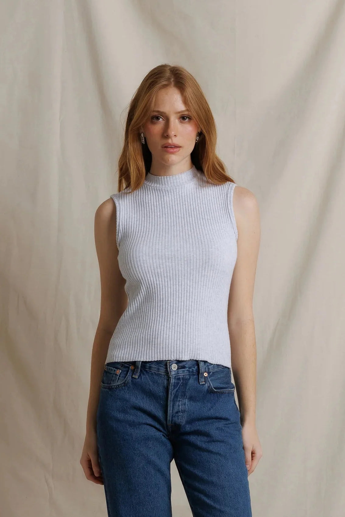 Perfect White Tee Violet sleeveless ribbed mock neck sweater styled with blue jeans