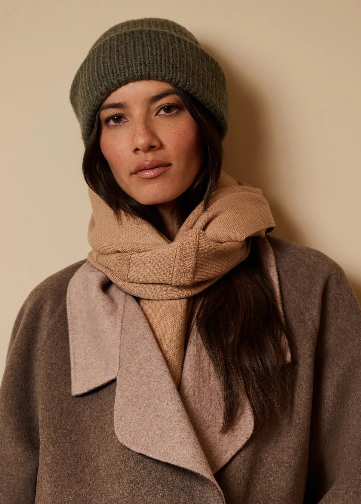Favorite Daughter braided olive beanie with neutral scarf and oversized coat
