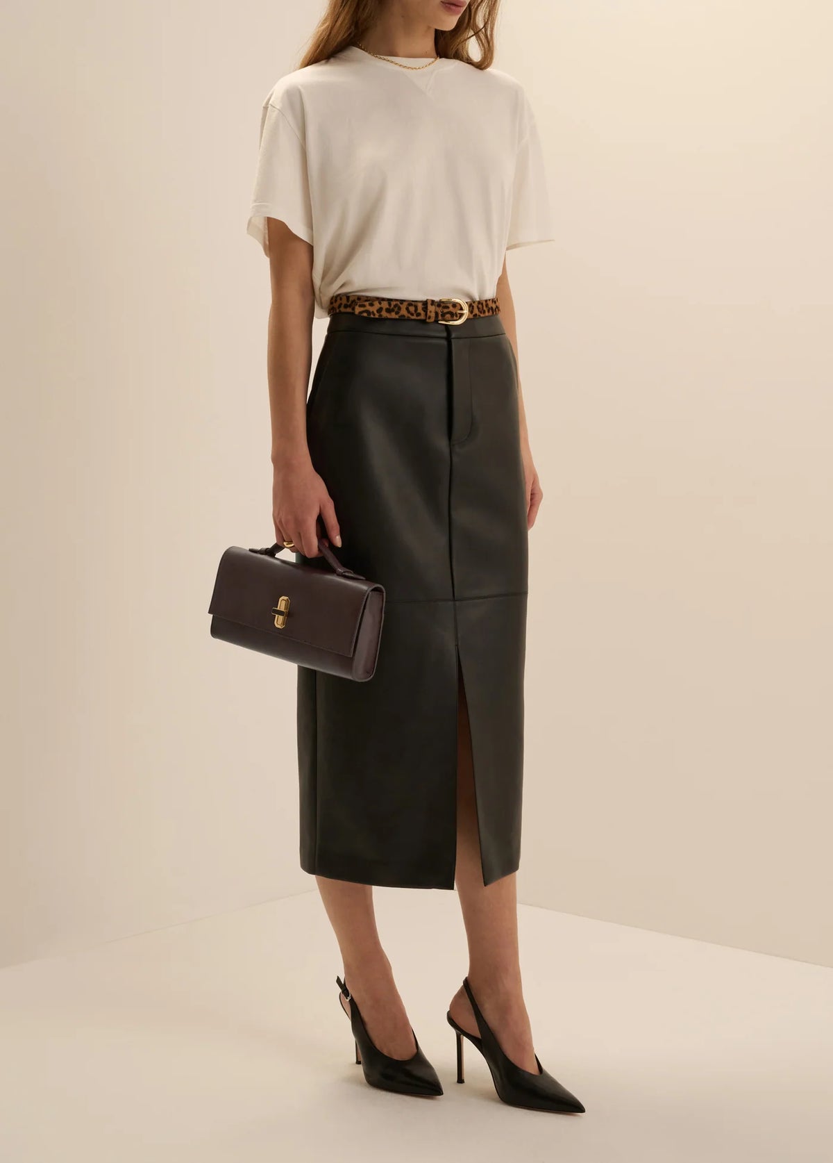 Favorite Daughter chocolate brown Heirloom Clutch styled with white top and tailored midi skirt
